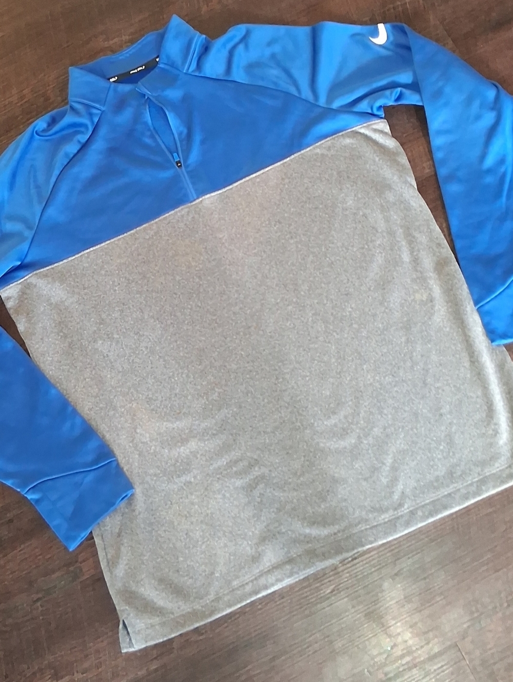 Nike Golf 1/4 zip pullover sweater in a blue and grey colorblock design.